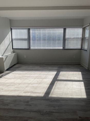 A room with a large window and a tiled floor. at 2400 Pennsylvania Avenue Apartments, Washington, DC,20037